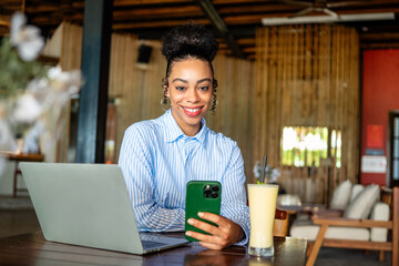 Remote work, communication. African american business woman on a phone call with a laptop working