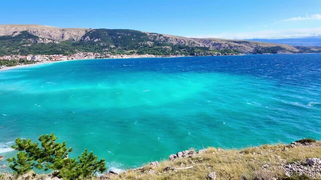 Stunning aerial view of vibrant turquoise sea and scenic coastline on a sunny day. Ba&scaron;ka, Krk island, Croatia