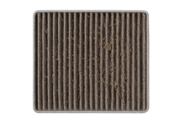Dirty cabin air filter full of dust, pollen, and debris, representing the need for regular car maintenance and replacement
