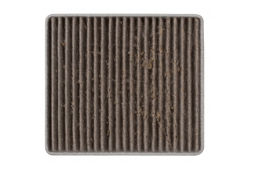 Dirty cabin air filter full of dust, pollen, and debris, representing the need for regular car maintenance and replacement