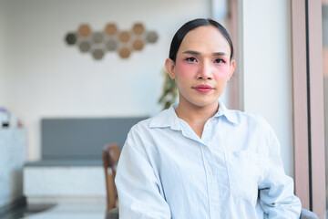 Portrait of a young Thai transgender business person at coffee shop