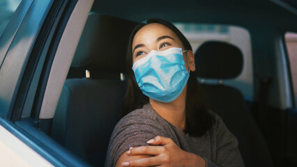 Woman, thinking and face mask in car with vaccination for disease, infection and illness...
