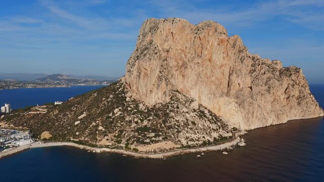 Aerial View of the Majestic Pe&ntilde;&oacute;n de Ifach Rock, Contrasting with the Coastal City's Dense Condos and High-Rise Apartments