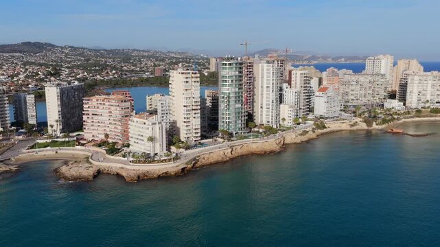 Aerial View of Calp, Spain and the Extensive Condos, Villas, and Prime Real Estate by the Majestic Pe&ntilde;&oacute;n de Ifach on the Mediterranean Coast