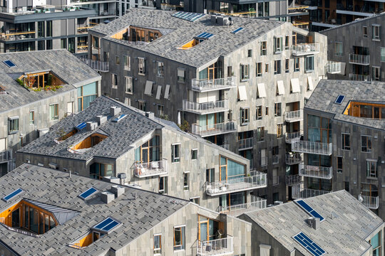 Architecture and development merging with modern buildings and housing across Bjorvika Oslo Norway, producing contrast with organized elevations and precise angular geometry