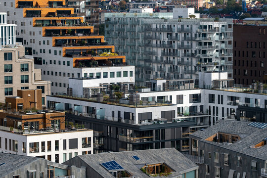 Modern architecture and housing shaping urban development in Bjorvika Oslo Norway, with buildings rising in clean lines and strong contrast across the evolving district