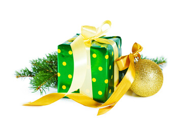 Elegant gift box with Christmas ball and fir branches isolated on white background.