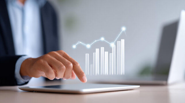 Focused businessman doing financial analysis on digital tablet. virtual chart shows business growth, data, and investment success with futuristic technology