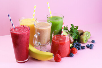 Different tasty smoothies in glasses and ingredients on pink background