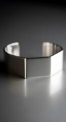Modern Silver Cuff Bracelet with Geometric Design.