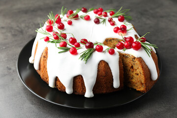 Tasty Christmas cake with cranberries on grey table, closeup