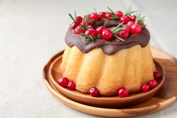Tasty Christmas cake with cranberries on light table, closeup
