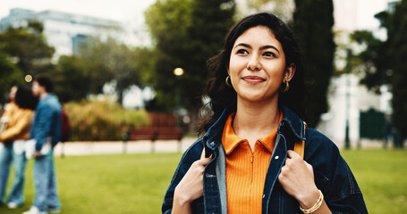 Campus, thinking and university with woman, student and contemplation with scholarship. Outdoor, college and person with ideas, choice and solution with higher education, knowledge and wonder