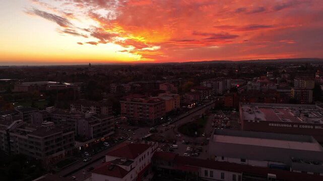 Verona,Italy-11 16 2025: Aerial drone flight over Verona&rsquo;s Borgo Corso Milano, showcasing residential buildings and the massive Esselunga supermarket in a dynamic urban cinematic view