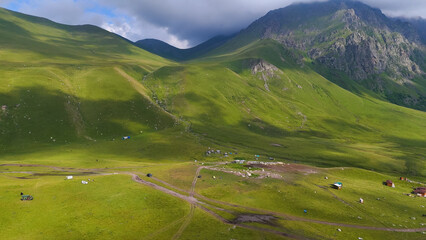 a drone flies over a campsite in a mountain gorge in the Jily-Su valley in the Caucasus, at the foot of Elbrus