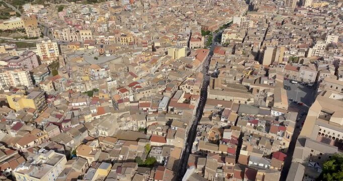 Aerial view of the historic center of Licata, a small town in the province of Agrigento, Sicily, Italy. There are many houses and buildings lined up next to each other.