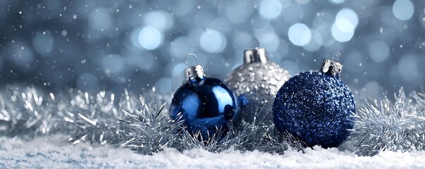 Sparkling blue and silver christmas ornaments with bokeh lights
