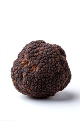 Close-up of single black truffle isolated on white background