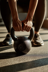Woman performing kettlebell workout in modern home gym