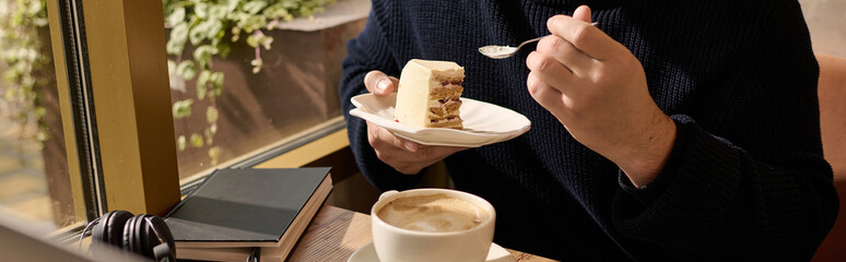 Elegant man enjoys cake and coffee while relaxing in a cozy cafe setting