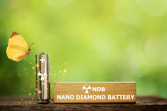 Nano diamond battery ,NDB text on wood ,old battery and icon on natural background.