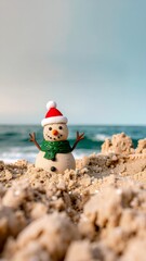 An adorable sandy snowman with a Santa hat and scarf brings holiday cheer to a sunny beach, celebrating a unique coastal Christmas