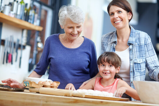 Happy mom, baker and generation with family in kitchen for learning or development together. Mother, grandpa and baking with smile, child or eggs for dough, dessert or fun childhood recipe in home