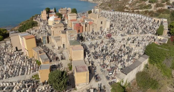 Aerial view of the cemetery of Licata, in the province of Agrigento, Sicily, Italy. It is a small Catholic cemetery overlooking the Mediterranean Sea.