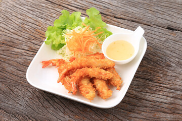 Crispy Batter Fried Prawns garnished with shredded cabbage and carrots, Food photography for use in menus