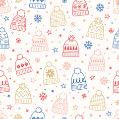 Colourful seamless pattern with winter hats in cartoon style. Vector illustration