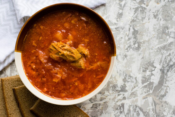 Delicious and aromatic red soup with meat, Ukrainian borscht. Traditional Ukrainian dish, cuisine