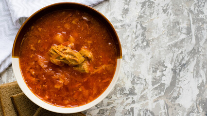Delicious and aromatic red soup with meat, Ukrainian borscht. Traditional Ukrainian dish, cuisine