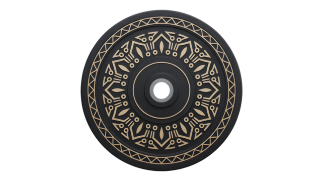 A round metal plate with intricate patterns rotates on a black background.