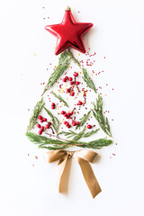 Festive christmas tree shaped cookie decorated with red berries and a star topper