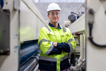 Team of engineer paper cardbox container factory in professional uniform check and analyse in paper industrial. Male factory worker testing program in high teachnology paper production line. worker.