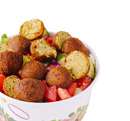 Enjoying fresh falafel salad with vegetables on a sunny day
