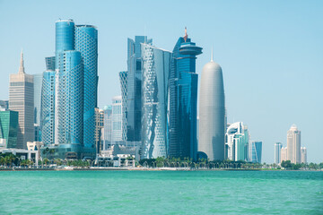 Skyline of Doha city business center with futuristic skyscrapers and a waterfront view in West Bay, Qatar. Modern architecture and futuristic cityscape in Gulf countries, Middle East