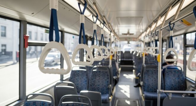 Ride the city bus with comfortable hanging handrails for convenient urban transport indoors