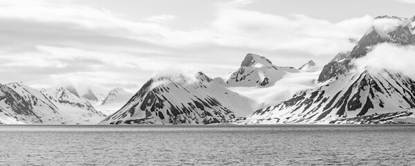 winter landscape with mountains, sea, snow and ice on spitsbergen Norway