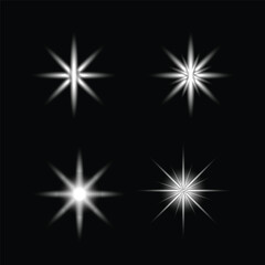 Four bright starbursts on a dark black background