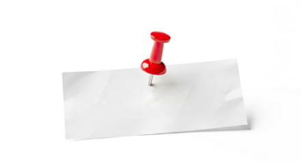 A red pushpin on a white paper sheet.