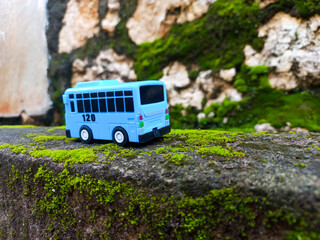 Blue toy bus for children, rear and side view