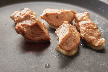Close-up of stewed beef meat in a frying pan
