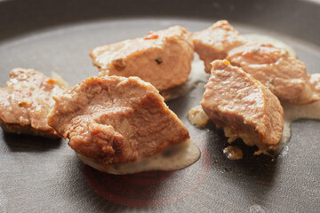 Close-up of stewed beef meat in a frying pan