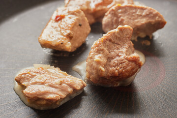 Close-up of stewed beef meat in a frying pan