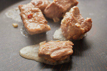 Close-up of stewed beef meat in a frying pan