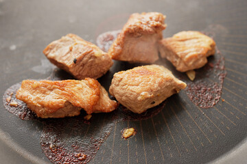 Close-up of stewed beef meat in a frying pan