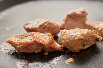 Close-up of stewed beef meat in a frying pan