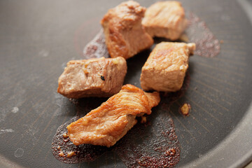 Close-up of stewed beef meat in a frying pan