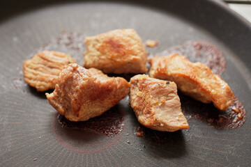 Close-up of stewed beef meat in a frying pan
